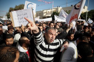 The UGTT union observed a general strike in Gafsa, south of Tunisia, on November 27Th 2013. Thousands of people protested and claimed their share in the development from the production phosphate. some protesters stormed the governorate headquarters and burned the Ennahdha headquarters. The police used tear gas on the protesters. (C) Chedly Ben Ibrahim